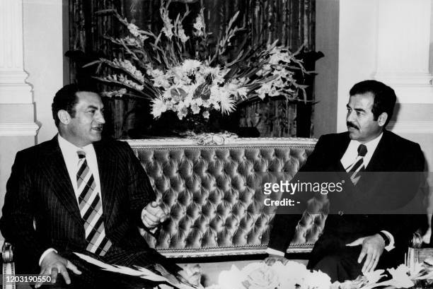 Egyptian vice-President Mohammed Hosni Mubarak meets Iraqi president Saddam Hussein , on november 1976, during an official visit in Bagdad.