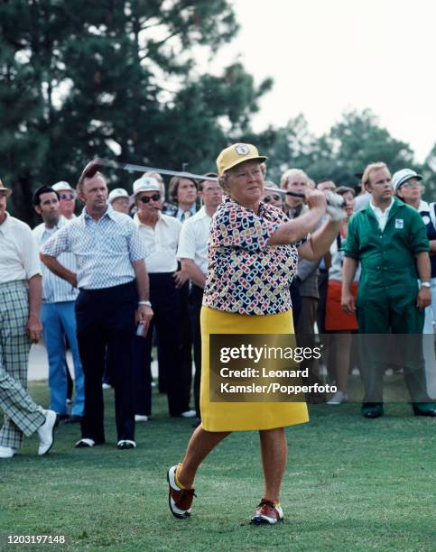 American golf legend Patty Berg tees off, circa 1974.