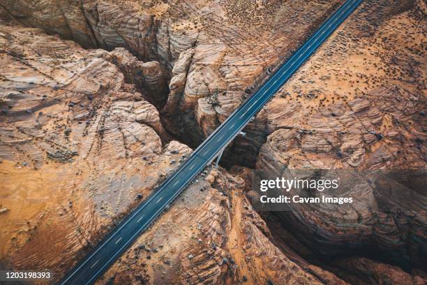 a slot canyon with a crossing road in arizona - fault geology stock pictures, royalty-free photos & images