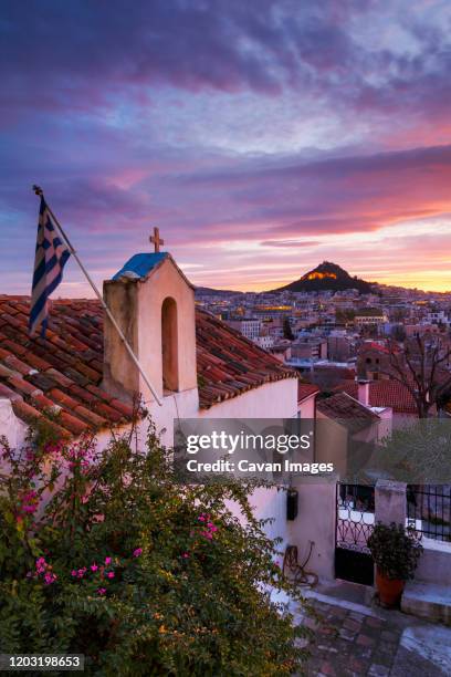 view of lycabettus hill from anafiotika neighborhood in the old town. - plaka stock pictures, royalty-free photos & images