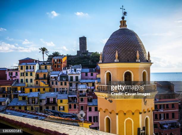 view of vernazza church and rooftops in cinque terra, italy. - vernazza fotografías e imágenes de stock