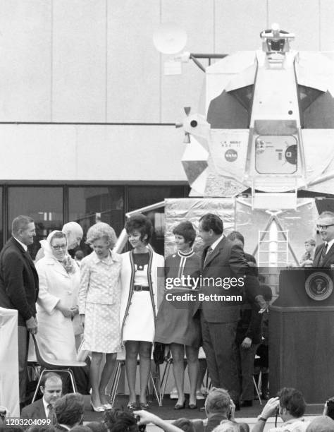 President Richard Nixon introduces the parents and wives of the Apollo 13 astronauts to a crowd that gathered at the Manned Spacecraft Center for...