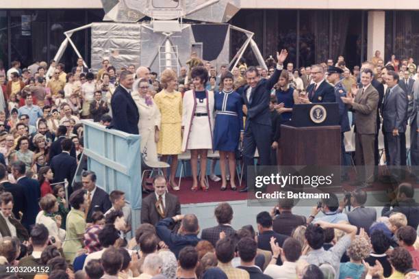 President Nixon waves during ceremonies celebrating the successful splashdown of the Apollo 13 after aborted moon mission. Left to right: on...