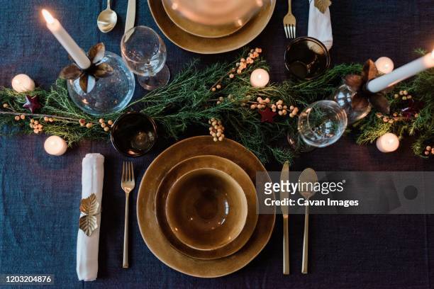 sky view of a modern dinner table setting with candles and greenery - table bildbanksfoton och bilder