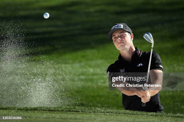 Viktor Hovland of Norway chips from the bunker onto the fifth green during the second round of the Waste Management Open at TPC Scottsdale on January...