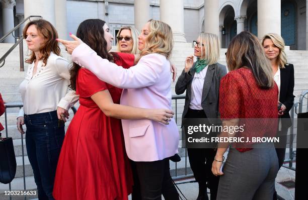 Lead plaintiff in the class action suit Louisette Geiss embraces Sarah Ann Masse as a group of Hollywood actresses and others, part of a group of...