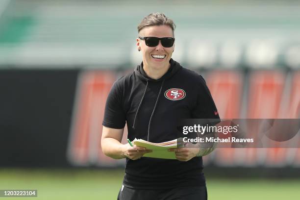 Offensive assistant coach Katie Sowers of the San Francisco 49ers looks on during practice for Super Bowl LIV at the Greentree Practice Fields on the...