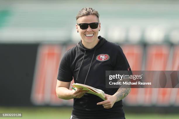 Offensive assistant coach Katie Sowers of the San Francisco 49ers looks on during practice for Super Bowl LIV at the Greentree Practice Fields on the...