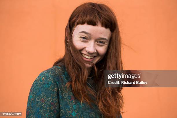 red haired woman with nose rings - portrait choice stockfoto's en -beelden