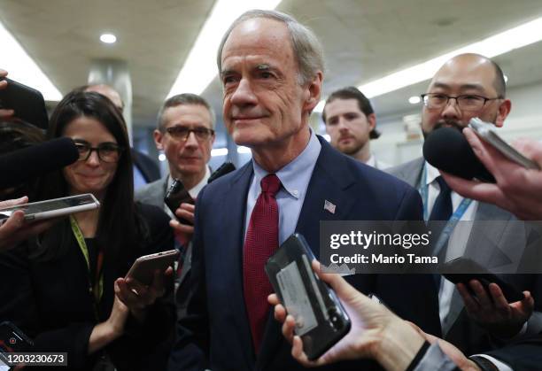 Sen. Tom Carper speaks to reporters as he arrives at the U.S. Capitol as the Senate impeachment trial of U.S. President Donald Trump continues on...