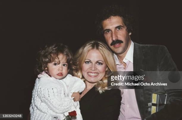 American actress Sally Struthers with her husband, psychiatrist William C Rader and their daughter Samantha, December 1980.