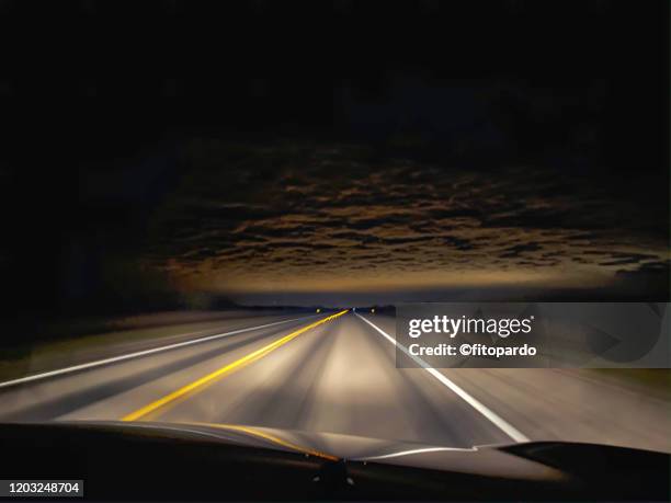 approaching laredo border town at night - texas road stock pictures, royalty-free photos & images