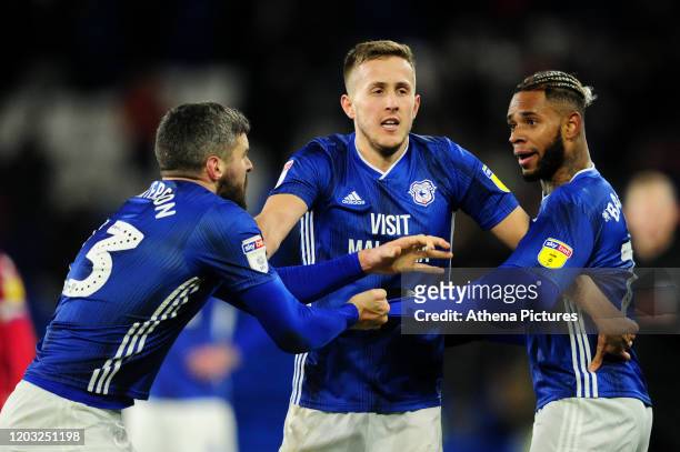 Team mates Callum Paterson and Leandro Bacuna are separated by Will Vaulks of Cardiff City during the Sky Bet Championship match between Cardiff City...