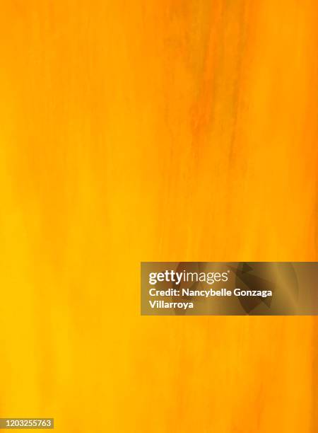 synthetic material in golden amber colour - amber stock pictures, royalty-free photos & images