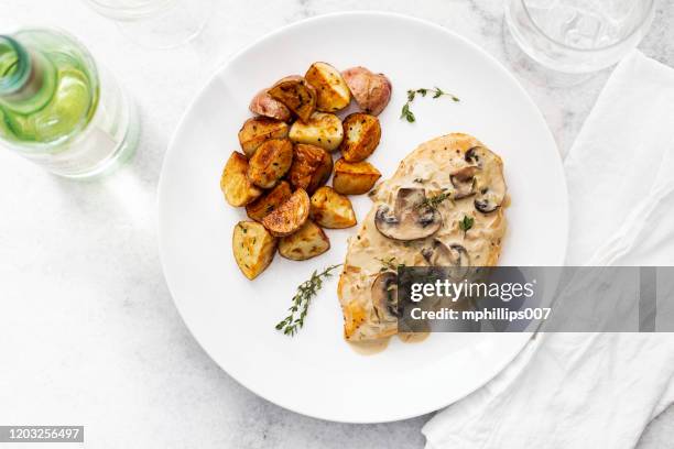 gourmet dijon chicken breast with thyme and potatoes - white plate stock pictures, royalty-free photos & images