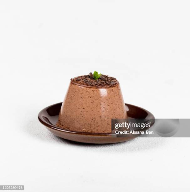 italian dessert panna cotta chocolate, creamy jelly on a light background - chocolate souffle stock-fotos und bilder