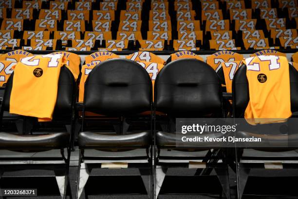 The Los Angeles Lakers honor Kobe Bryant and daughter Gigi by with empty courtside seats before the game against the Portland Trail Blazers at...