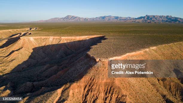 aerial view of table mountains in a highland nearby mesquite, nevada, usa, in the early springtime. - mesquite nevada stock pictures, royalty-free photos & images