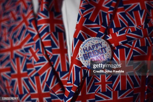 Pro Brexit supporter wears a Union Jack suit and a "Happy Brexit Day" badge during the Leave Means Leave, Brexit day celebration party outside the...