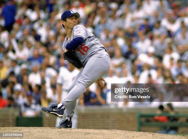 Hideo Nomo of the Los Angeles Dodgers pitches during an MLB game at Wrigley Field in Chicago, Illinois. Nomo played for 12 seasons with 7 different...