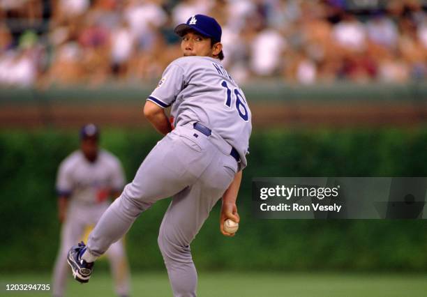 Hideo Nomo of the Los Angeles Dodgers pitches during an MLB game at Wrigley Field in Chicago, Illinois. Nomo played for 12 seasons with 7 different...