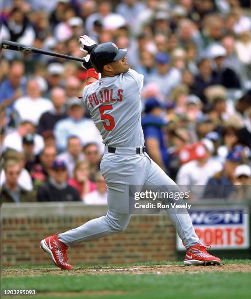 Albert Pujols of the St. Louis Cardinals bats during an MLB game at Wrigley Field in Chicago, Illinois. Pujols has played for 19 seasons with 2...