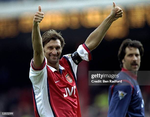 Tony Adams of Arsenal salutes the fans during the FA Carling Premiership match against Aston Villa played at Highbury in London, England. The match...