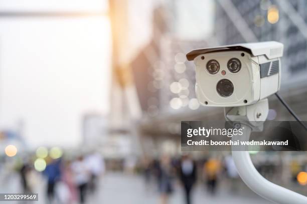 cctv or surveillance computer operating at the bridge, walkway, street blurred with people walking - security camera view stock pictures, royalty-free photos & images
