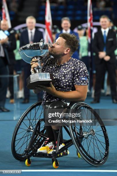 Dylan Alcott of Australia holds aloft the championship trophy following his Quad Wheelchair Singles Final match against Andy Lapthorne of Great...