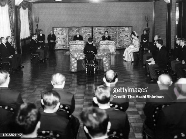 Emperor Hirohito and Empress Nagako attend the 'Kosho-Hajime-no-Gi' first lecture of the New Year at the Imperial Palace on January 8, 1964 in Tokyo,...