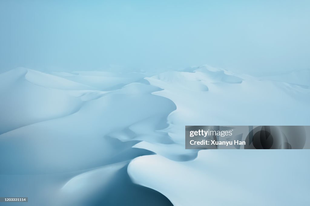 Snow covered desert sand dunes in winter