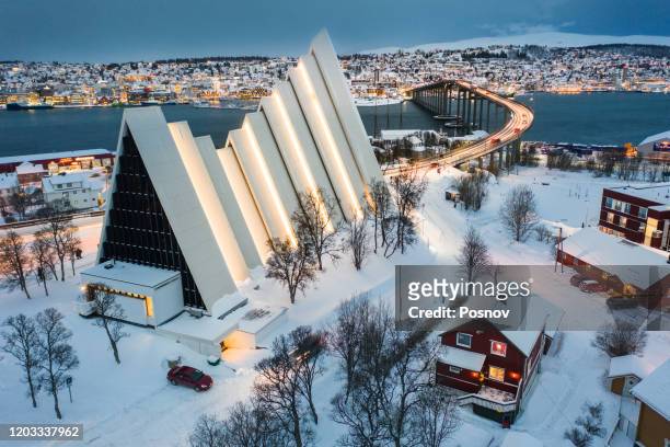 arctic cathedral and tromso bridge - norway winter stock pictures, royalty-free photos & images