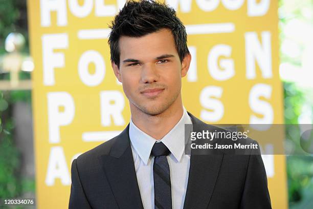Actor Taylor Lautner arrives at The Hollywood Foreign Press Association's 2011 Installation Luncheon at Beverly Hills Hotel on August 4, 2011 in...