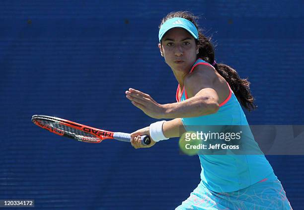 Christina McHale returns a forehand to Agnieszka Radwanska of Poland during the Mercury Insurance Open presented by Tri-City Medical at the La Costa...