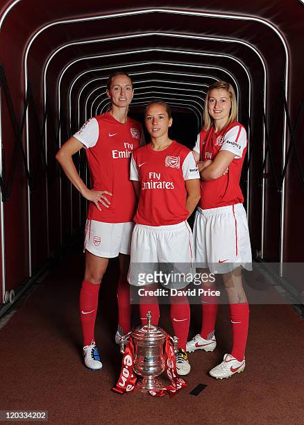 Faye White, Jordan Nobbs and Ellen White of Arsenal Ladies pose with the Women's FA Cup Trophy during the ladies team photocall at Emirates Stadium...