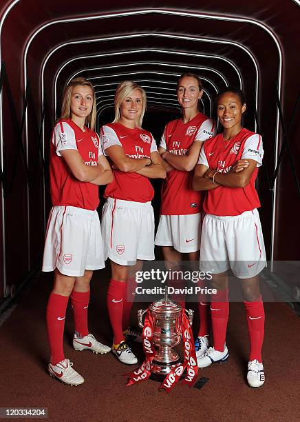 Ellen White, Steph Houghton, Faye White and Rachel Yankey of Arsenal Ladies pose with Women's FA Cup Trophy during the ladies team photocall at...