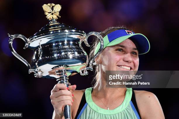 Sofia Kenin of the United States poses with the Daphne Akhurst Memorial Cup after winning her Women's Singles Final match against Garbine Muguruza of...