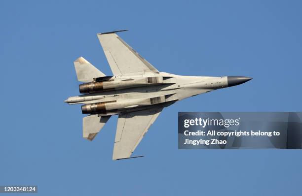 bottom view of chinese air force fighter - airstrike fotografías e imágenes de stock