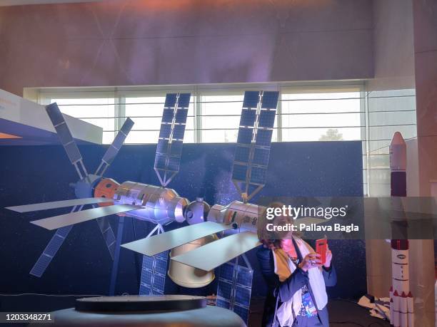 A space buff takes a selfie with the space station model. India unveiled a scaled model of its proposed Space Station that it wants to start building...