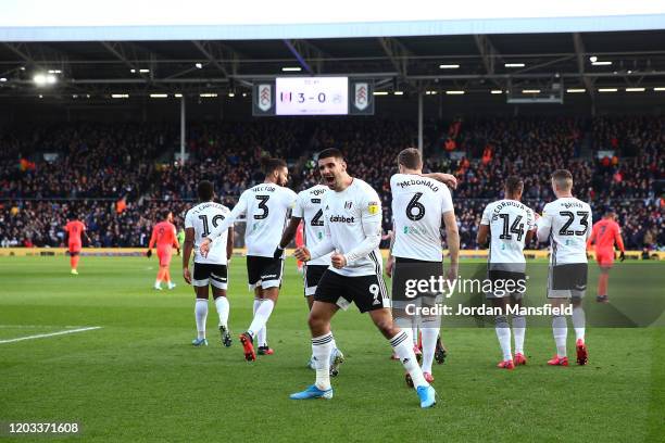 Aleksandar Mitrovic of Fulham celebrates scoring his sides third goal during the Sky Bet Championship match between Fulham and Huddersfield Town at...