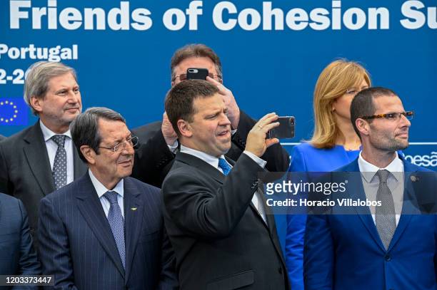 Jüri Ratas , Prime Minister of Estonia, films the rendition of cante alentejano after the family photo during the Friends of Cohesion summit convened...