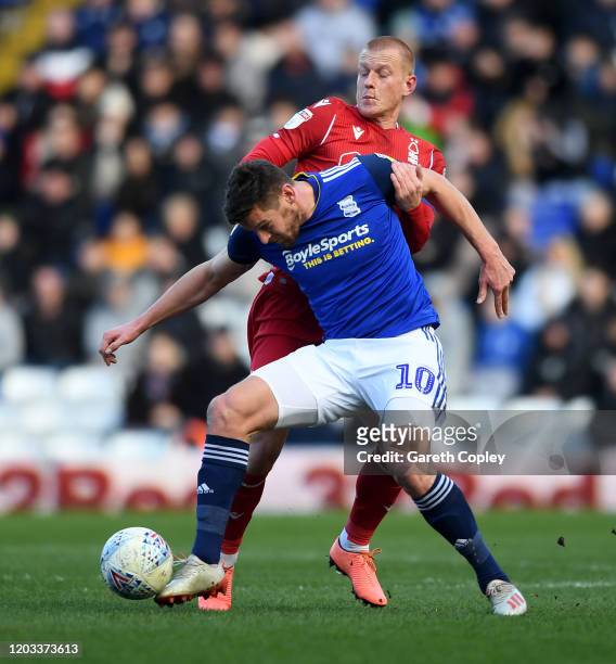 Lukas Jutkiewicz of Birmingham City is tackled by Ben Watson of Nottingham Forest during the Sky Bet Championship match between Birmingham City and...