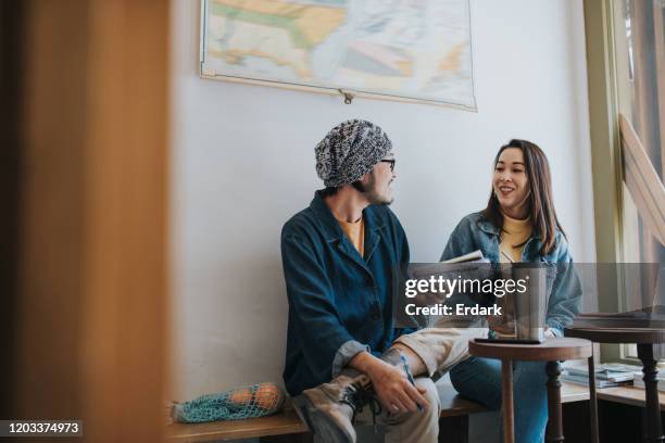 thai couple brainstorming work at the coffee shop - film director asian stock pictures, royalty-free photos & images