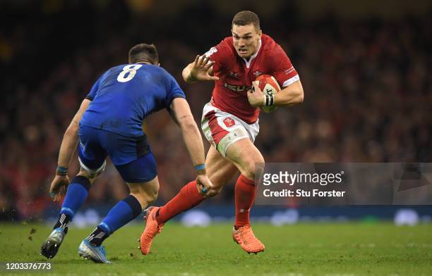 Wales centre George North makes a break past Italy player Abraham Steyn during the 2020 Guinness Six Nations match between Wales and Italy at...