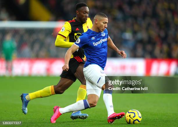 Richarlison of Everton is challenged by Danny Welbeck of Watford during the Premier League match between Watford FC and Everton FC at Vicarage Road...