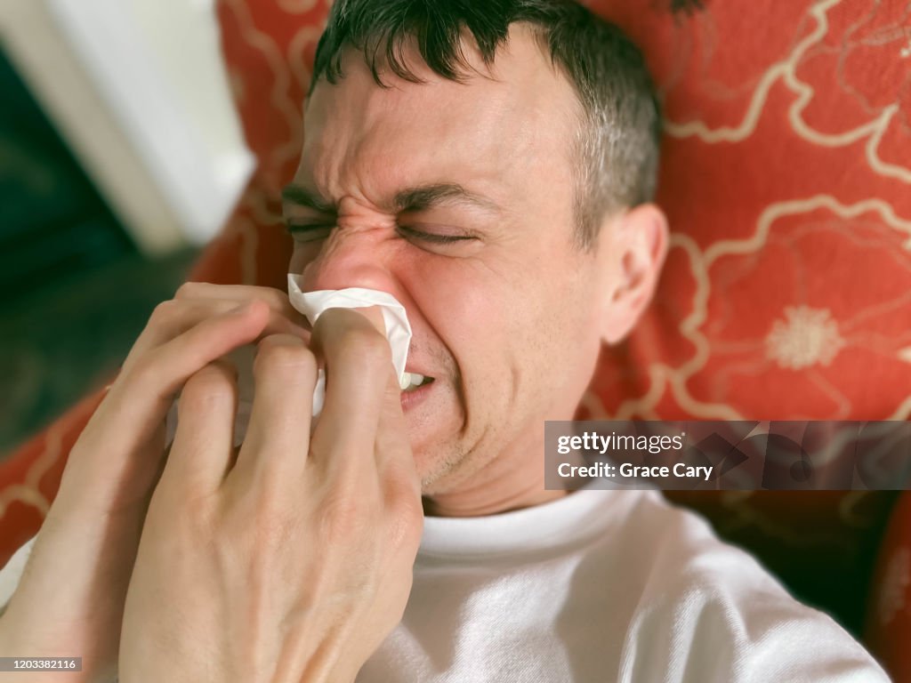 Close-Up of Man Wiping His Nose