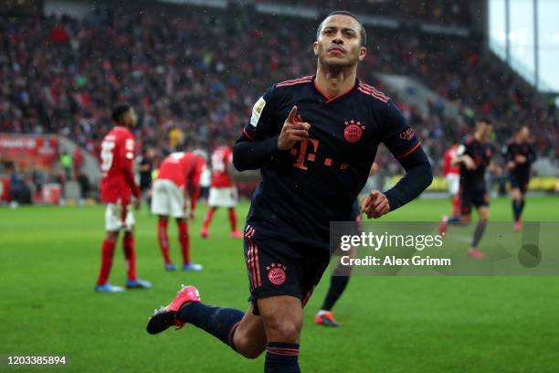 Thiago Alcantara of Muenchen celebrates his team's third goal during the Bundesliga match between 1. FSV Mainz 05 and FC Bayern Muenchen at Opel...