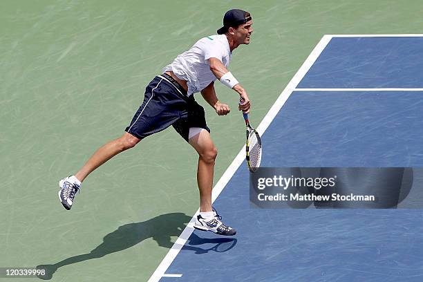 Ryan Sweeting serves to Gael Monfils of France during the Legg Mason Tennis Classic presented by Geico at the William H.G. FitzGerald Tennis Center...