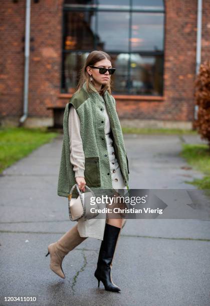 Swantje Sömmer seen wearing green sleeveless jacket, dress, two tone boots outside Baum und Pferdgarten during Copenhagen Fashion Week Autumn/Winter...