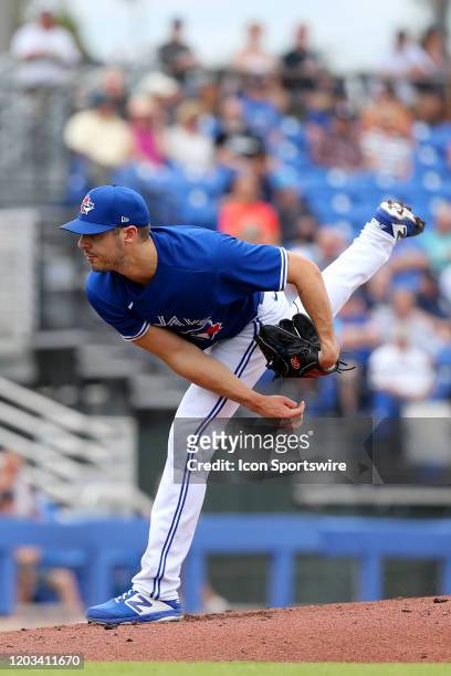 Julian Merryweather of the Blue Jays delivers a pitch to the plate during the spring training game between the New York Yankees and the Toronto Blue...